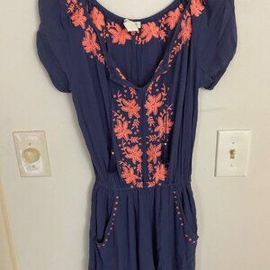 Blue jumpsuit with embroidery.